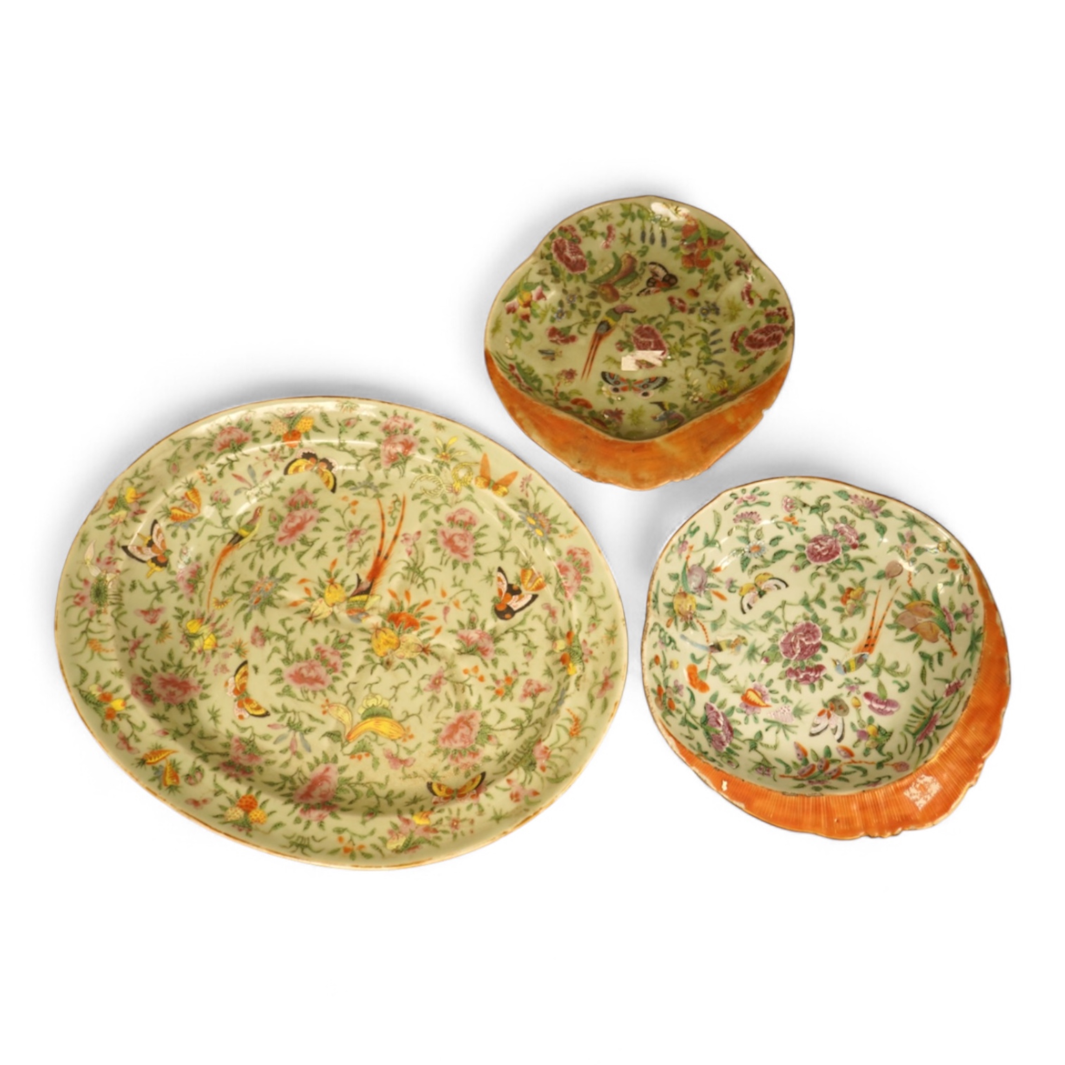 A Chinese celadon ground famille rose dish and two similar dessert dishes, c.1830, meat dish 42cm wide